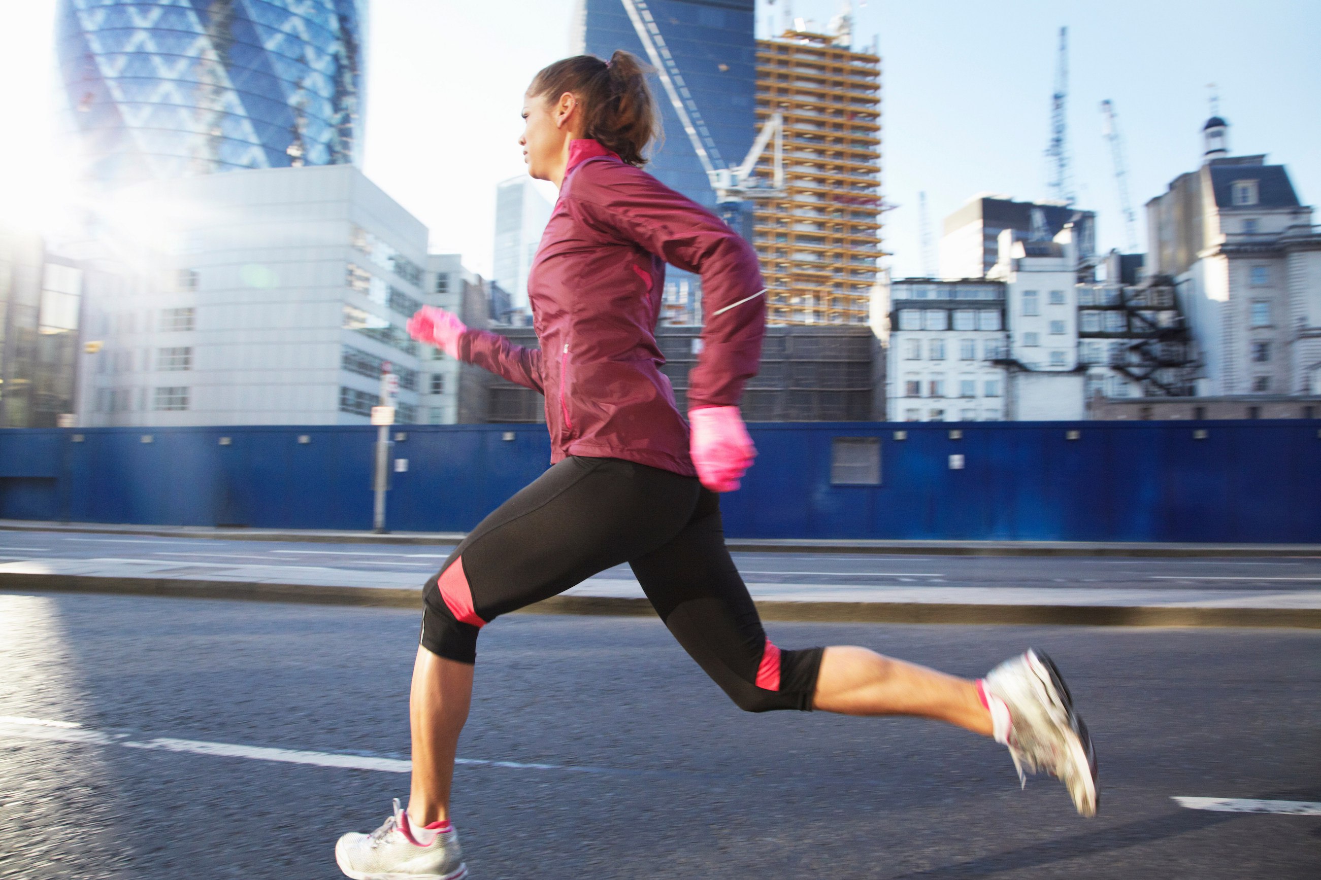 Woman running on city street